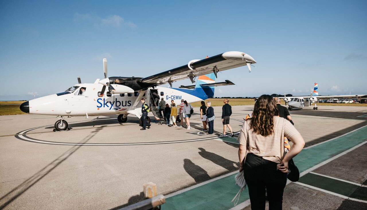People boarding a Skybus Twin Otter at Land's End Airport