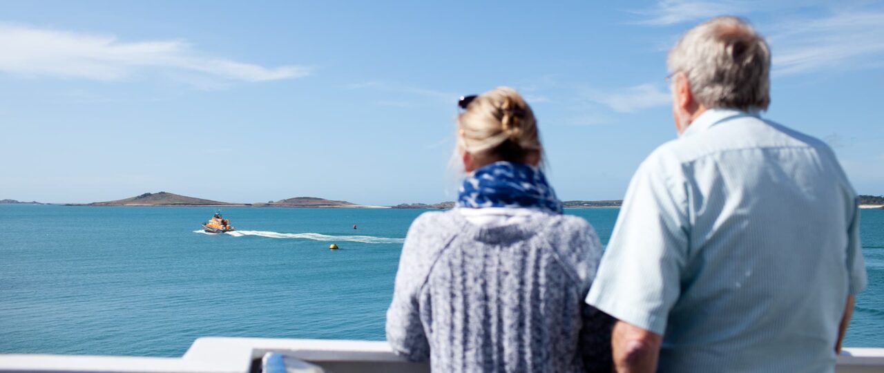 Roger and Pasty Manning's looking at the island views from Scillonian III