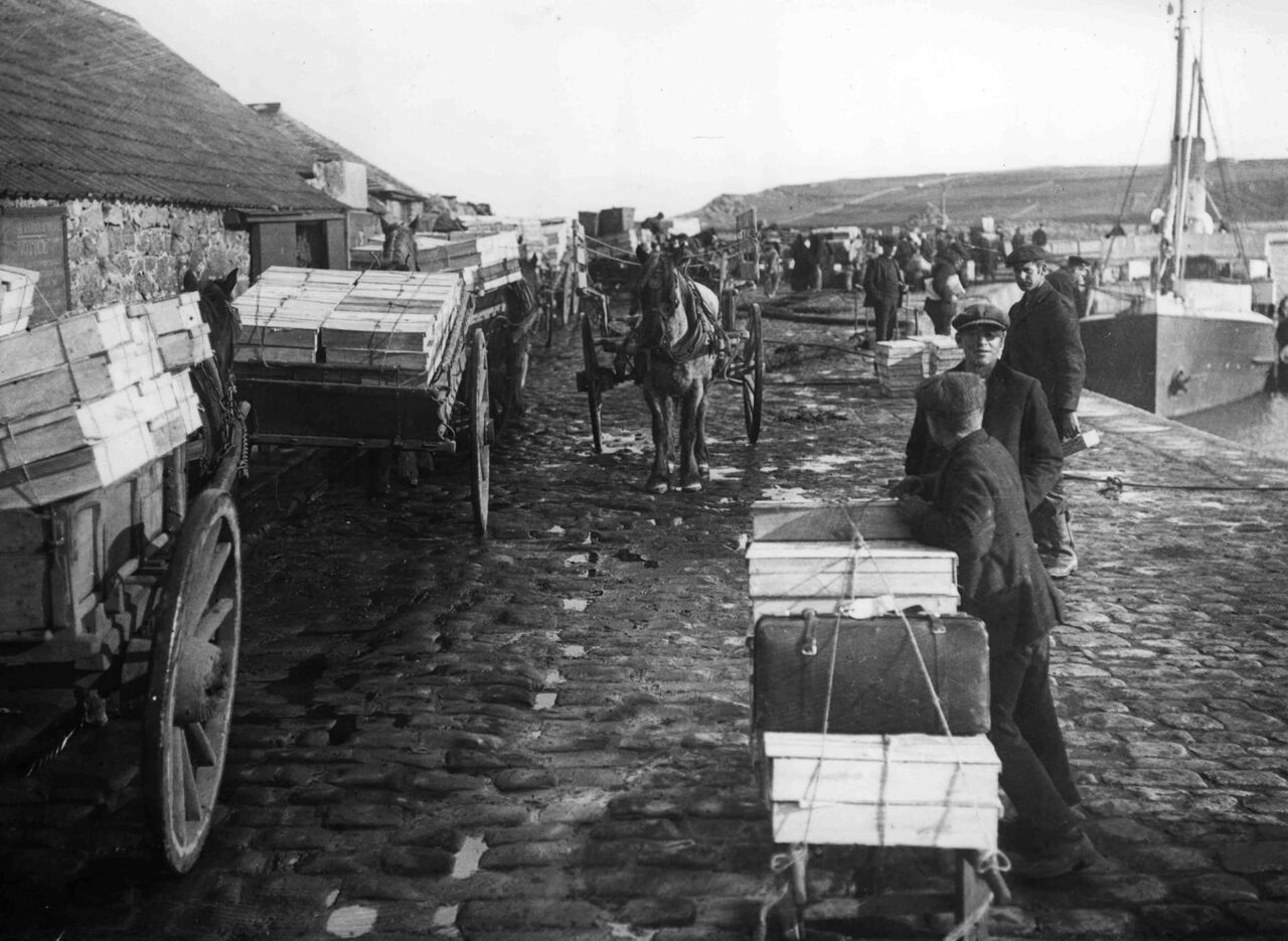Historic image of flowers being taken to St Mary's quay taken by the Gibson family