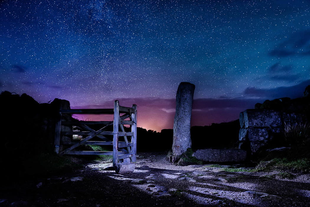 night skies above a walking coastal path and gate on the Isles of Scilly