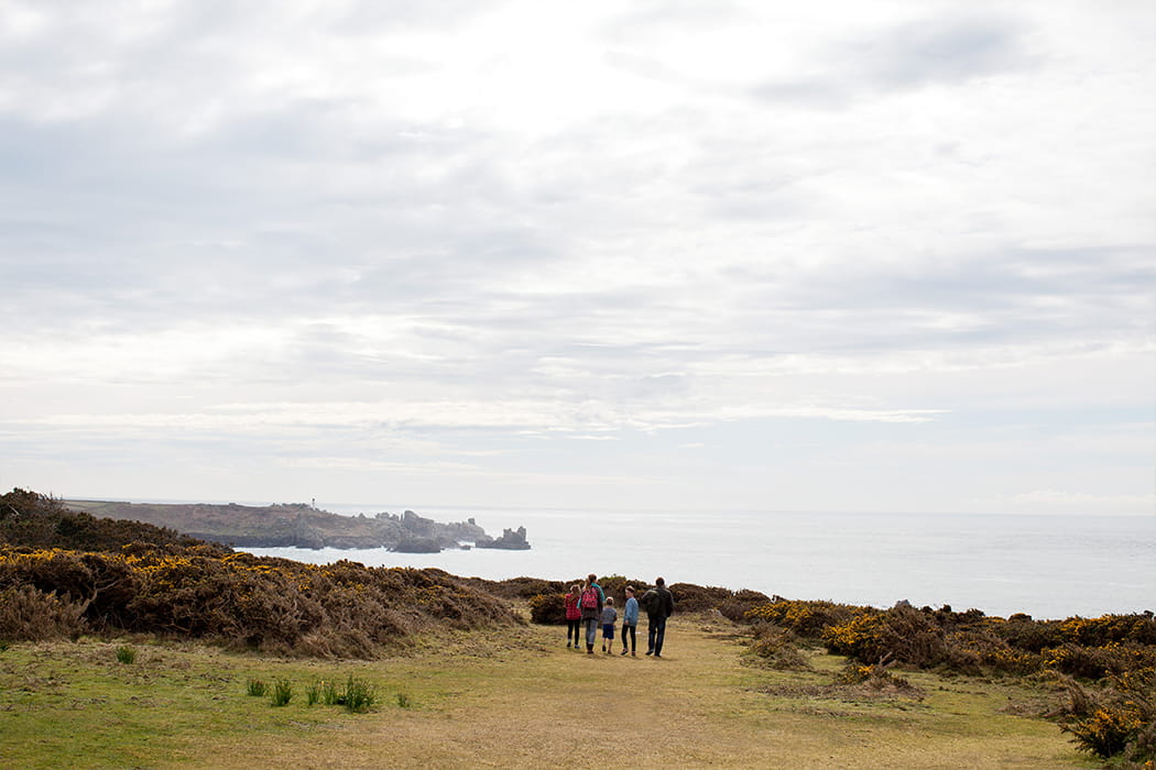 family of 5 walking on St Mary's, Isles of Scilly