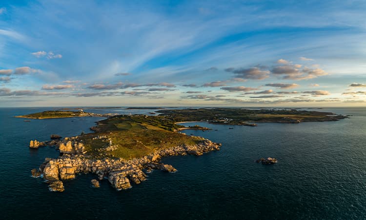 Aerial view of the sun setting over St Mary's, Isles of Scilly
