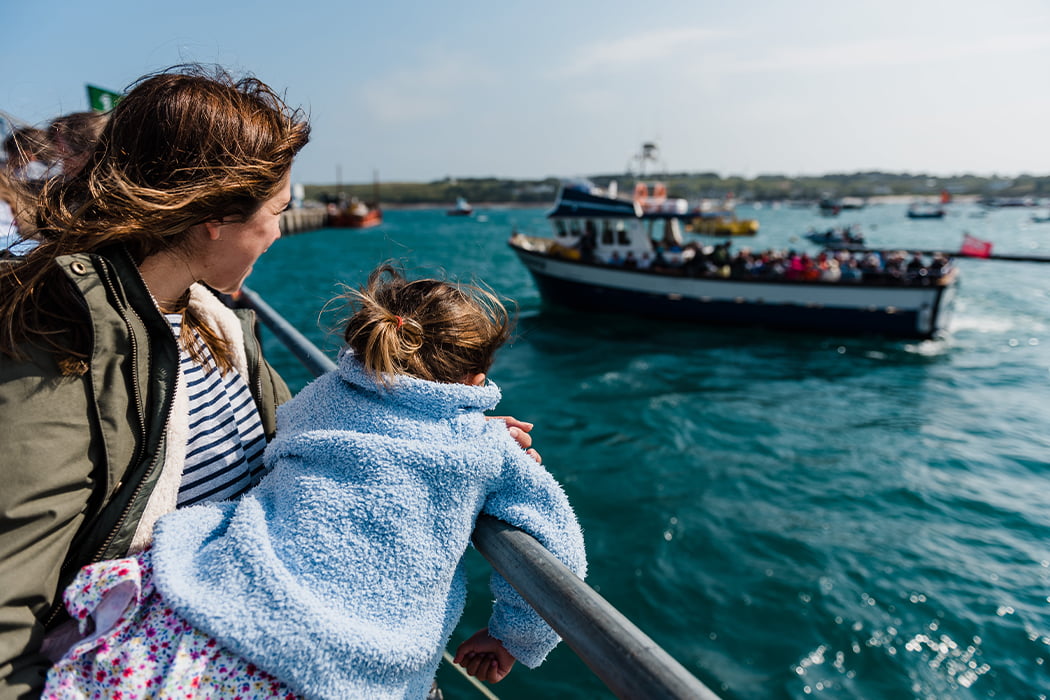 Family waiting on St Mary's Quay for the tripper boat - Isles of Scilly