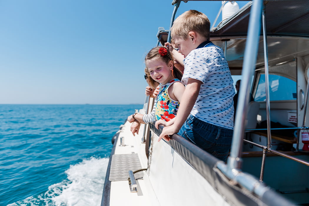 Family on a boat trip in the Isles of Scilly