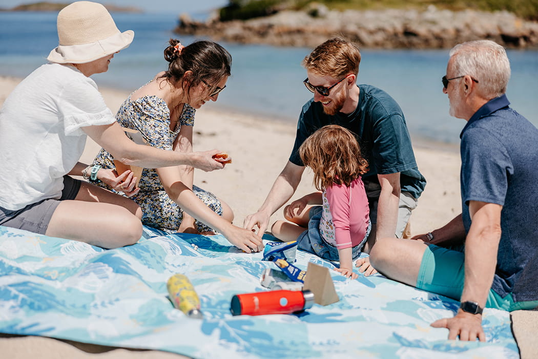 Family enjoying a beach picnic on the beach, st mary's, Isles of Scilly