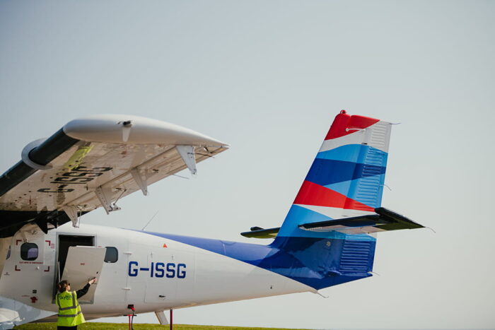 Door opening on a Skybus Twin Otter aircraft at St Mary's Airport 