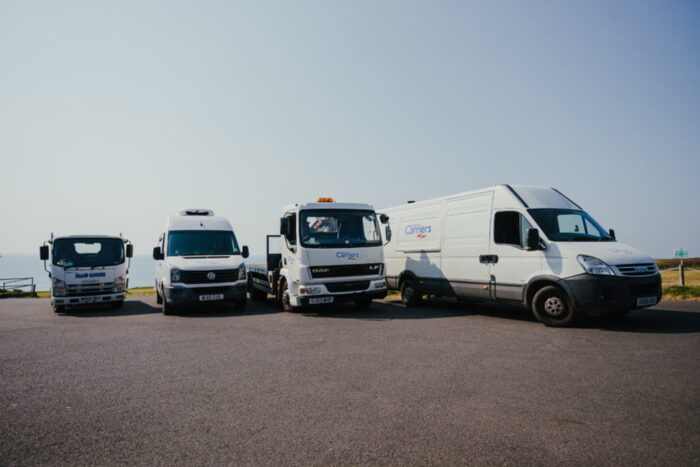 Line up of the Island Carrier vehicles on St Mary's, Isles of Scilly