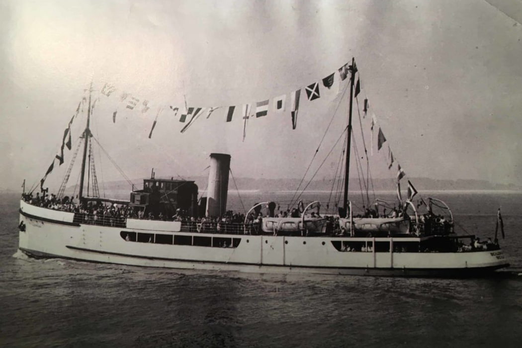 Scillonian I sailing in her dress flags