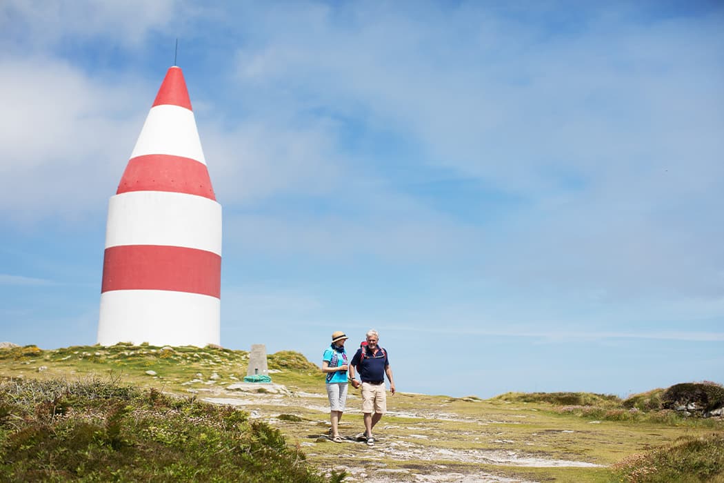 older couple walking down from the Day Mark  on St Martin's