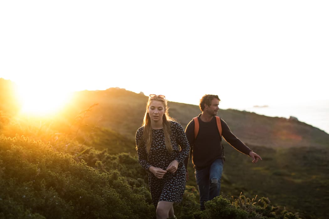 younger couple taking an evening walk on the Isles of Scilly