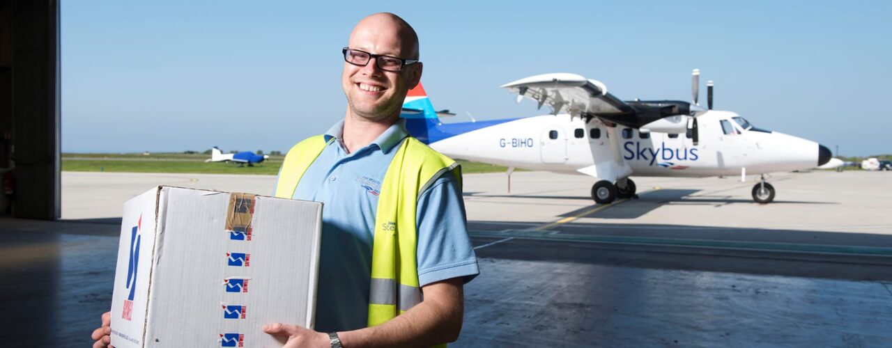 Chris Buxton - Engineer stores supervisor in front of a Skybus Twin Otter at Land's End Airport