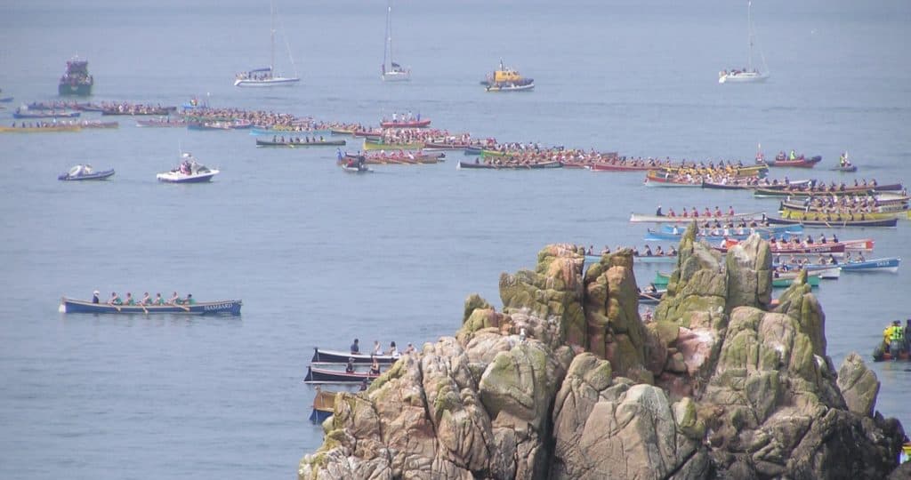view of the pilot gig boats getting ready to race at the world pilot gig championships on the Isles of Scilly 