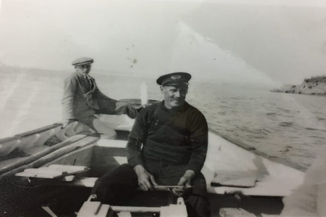 Robert Ellis sitting in a boat