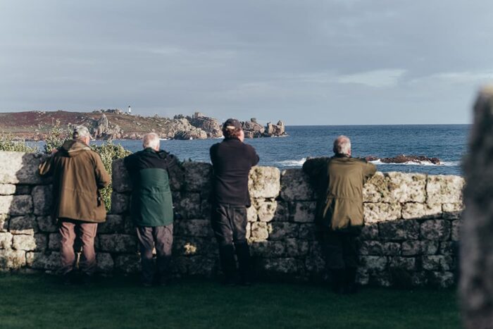 4 people bird watching on the Garrison, St Mary's, Isles of Scilly