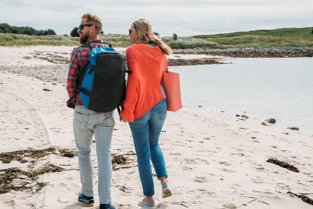 couple on an autumn beach walk, Bryher, Isles of Scilly