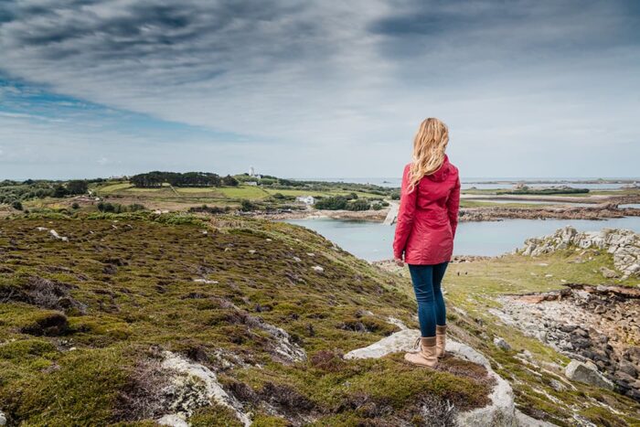 Woman standing on Kittern Hill, Gugh, Isles of Scilly