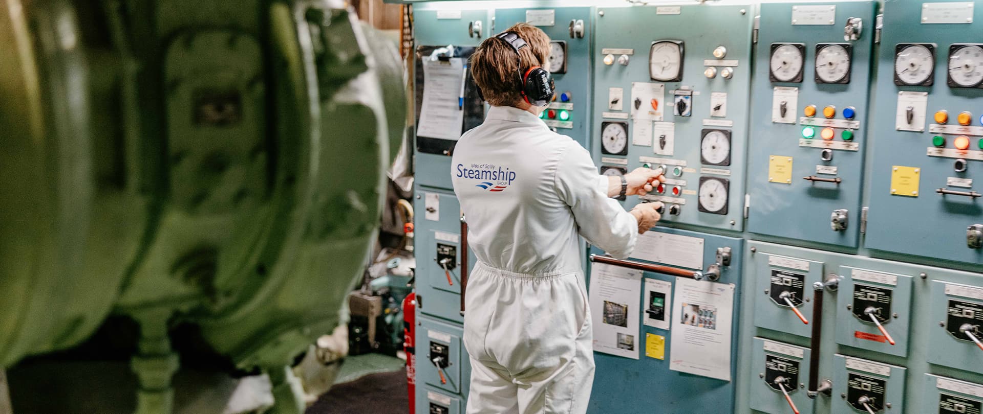 one marine engineer carrying out maintenance checks in the engine room on Scillonian III