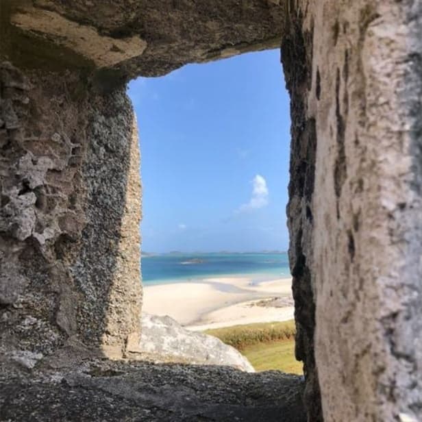 Blockhouse window framing the beach view, Tresco, Isles of Scilly
