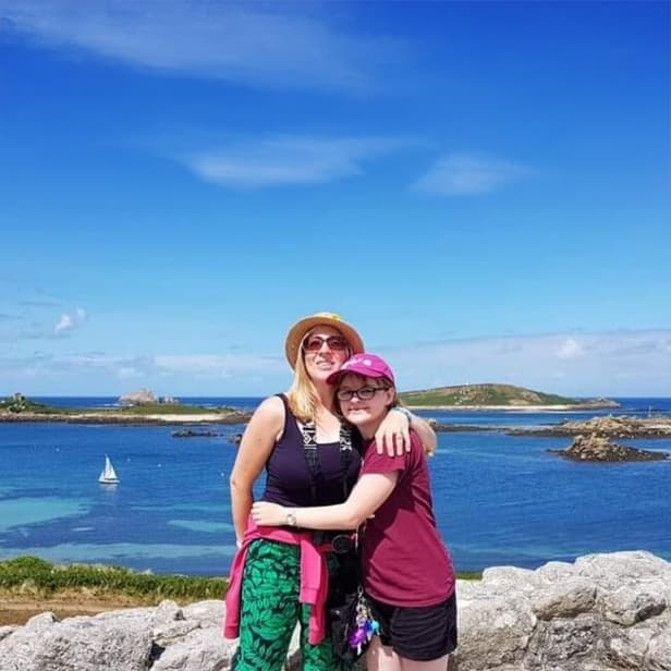 Mother and daughter standing on the blockhouse, Tresco, Isles of Scilly