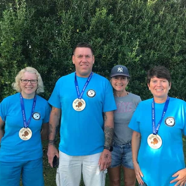 Competitors from Scilly Swim Challenge with their medals