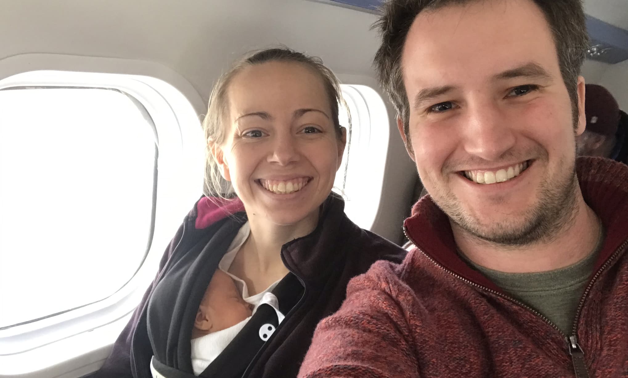 parents bringing their baby home on Skybus