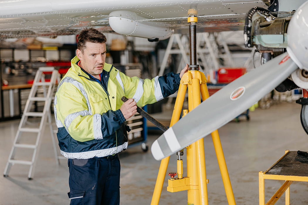 Skybus engineer working on a Skybus aircraft