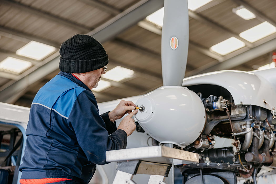 Skybus engineer working on a Skybus Islander aircraft