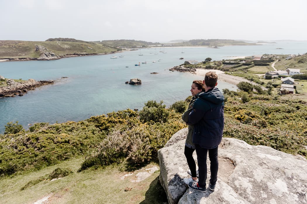 Couple admiring the view from Watch Hill, Bryher, Isles of Scilly