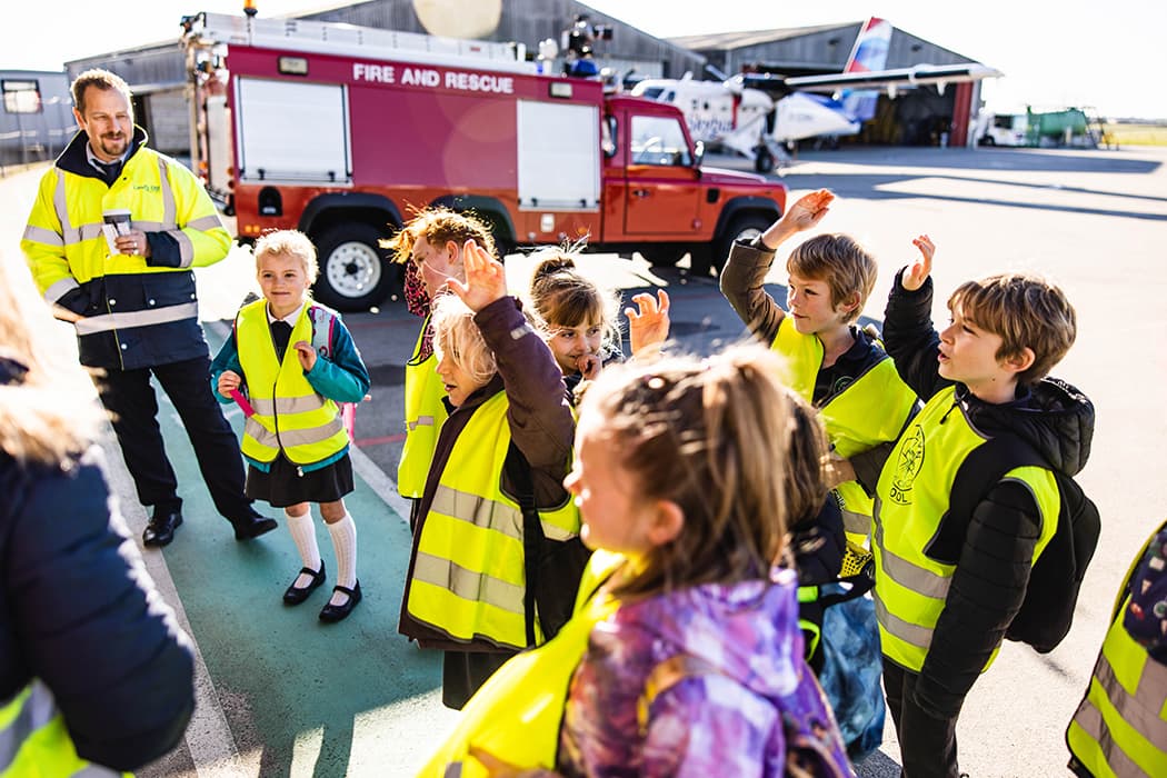 Children from Newlyn School looking around Land's End airport fire department