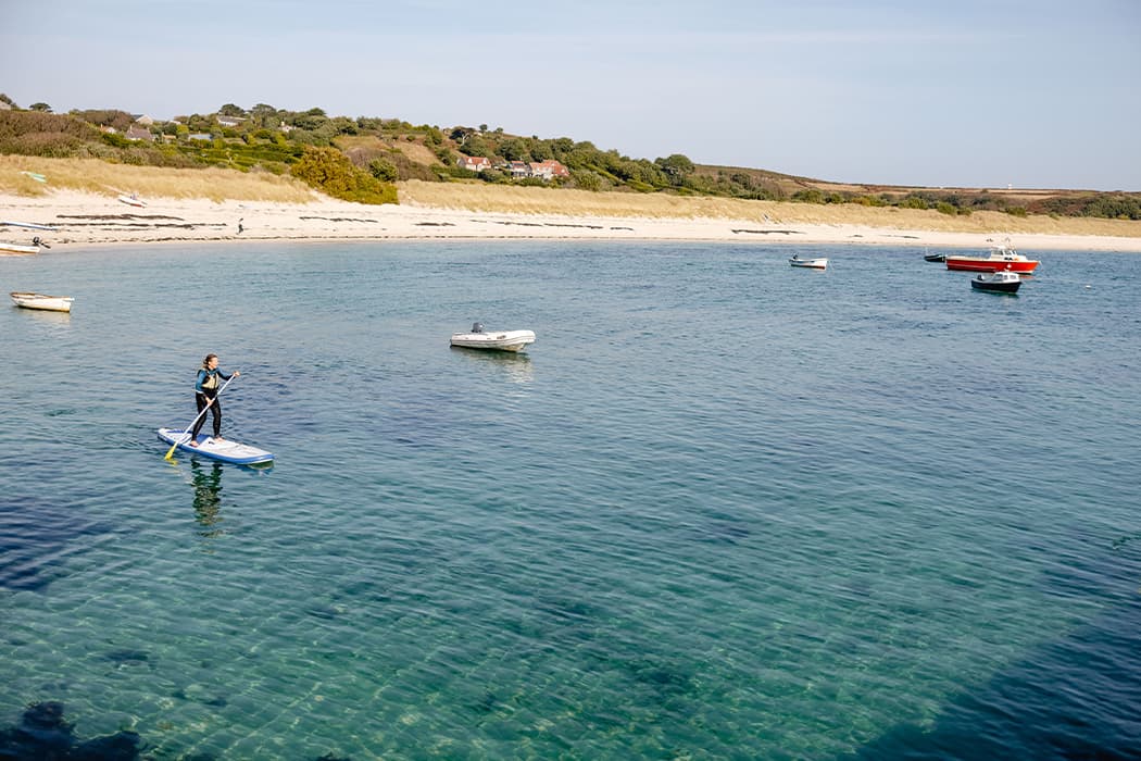 St Martin's Watersports - woman paddle boarding - Par Beach, Higher Town, St martin's