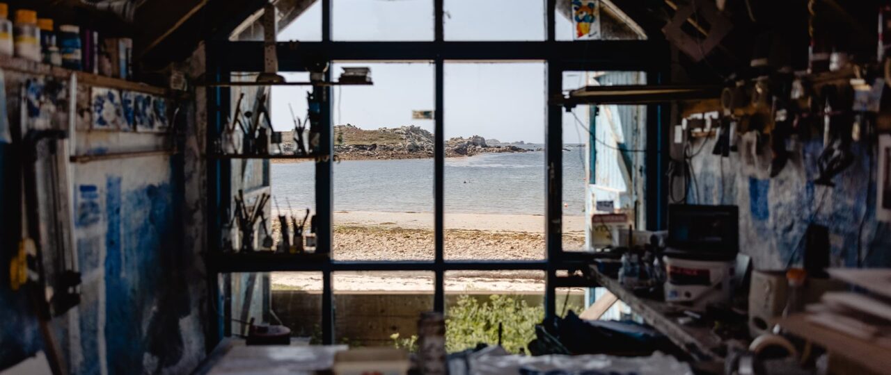 Golden Eagle Studio (The old gig shed) window has views out to Great Par beach on Bryher.