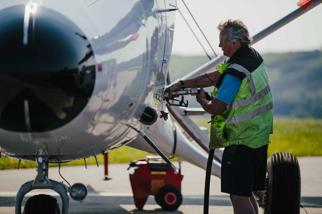 Island Carriers team member refuelling a Skybus Twin Otter aircraft