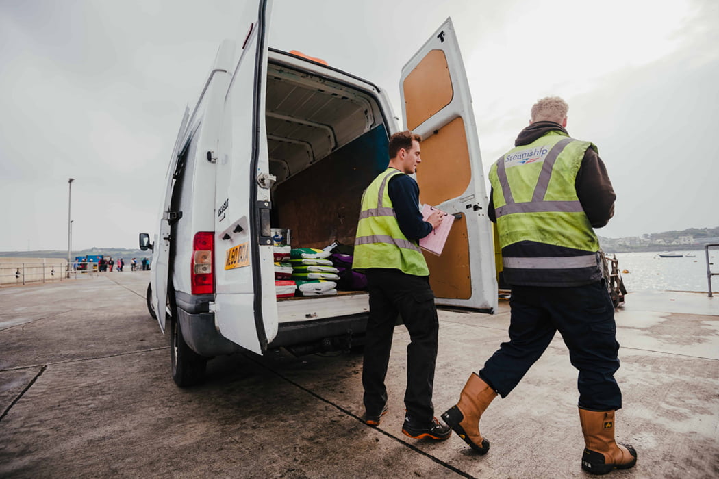 Island Carriers team delivering items to St Mary's Quay in one of the vans