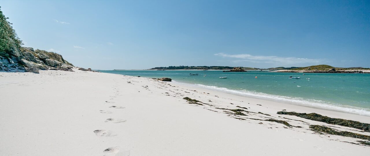The Flats beach at Lawrences Bay with footprints in the sand - St Martin's Isles of Scilly