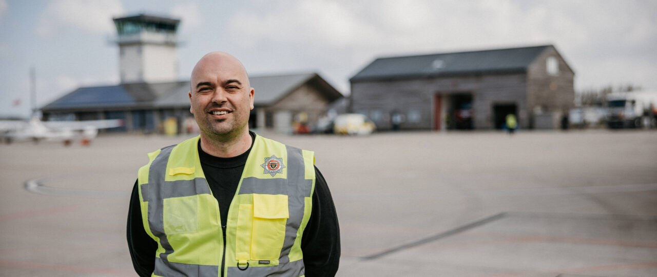 Jono - fire service manager standing in front of Land's End Airport