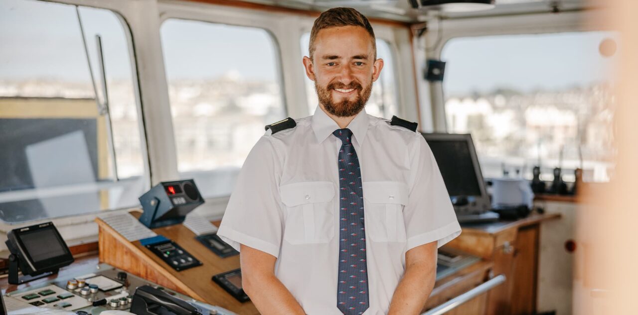 Deck officer cadet Elliot Pleven standing on Scillonian III bridge