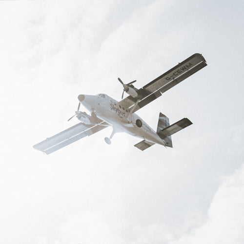 Skybus twin otter aircraft flying - Isles of Scilly Travel