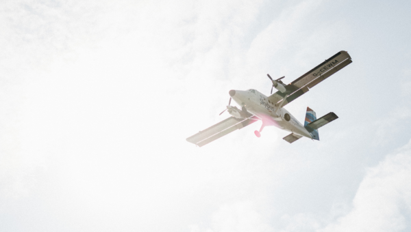 Skybus flying in the sky to the Isles of Scilly on a sunny day