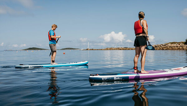 Couple paddleboarding - Porthmellon, St Mary's, Isles of Scilly