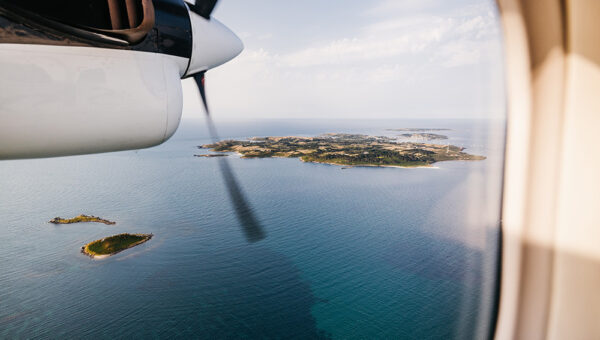 Plane flying over islands