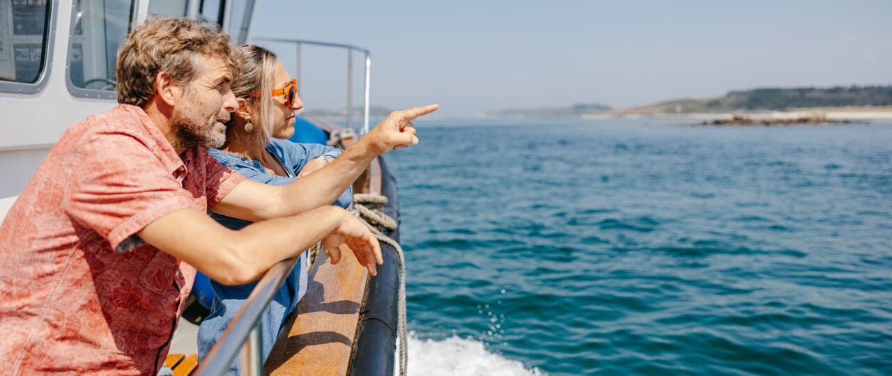 Couple on a tripper boat to Tresco, Isles of Scilly