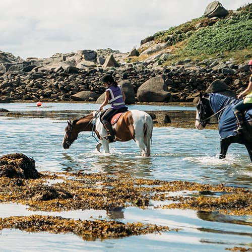 Horse riders in the sea, St Mary's, Isles of Scilly
