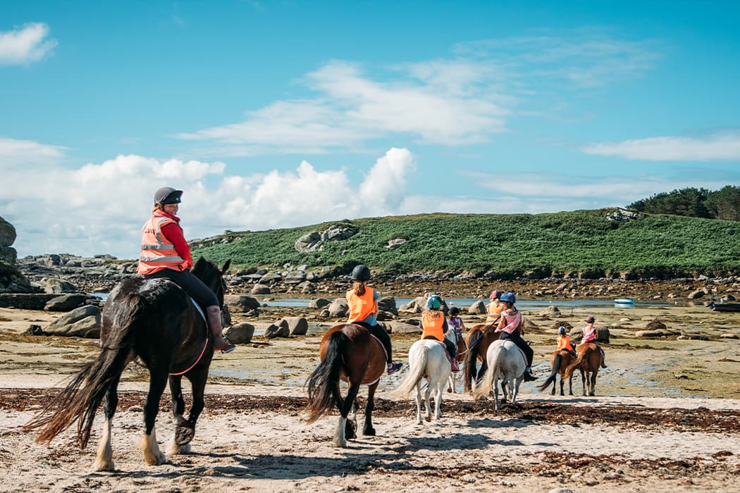 A group of horse riders on the beach, St Mary's, Isles of Scilly