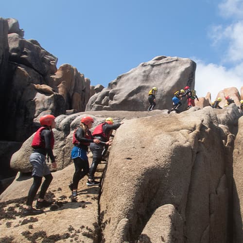 a group of people on a coasteering tour, Peninnis head, St Marys