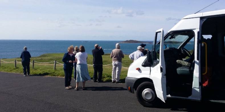 Tourists looking out to sea