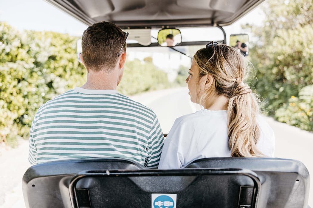 Couple in a scilly cart driving down a country road, st mary's, Isles of Scilly