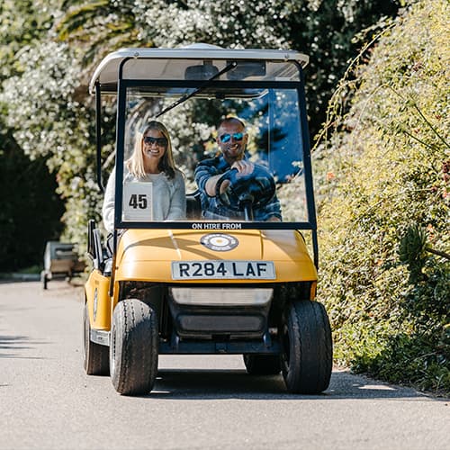 Couple in a scilly cart enjoying driving around st mary's, Isles of Scilly