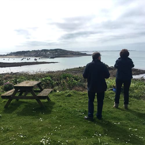 People admiring the view on an Island Rover mini bus tour, St Mary's Isles of Scilly