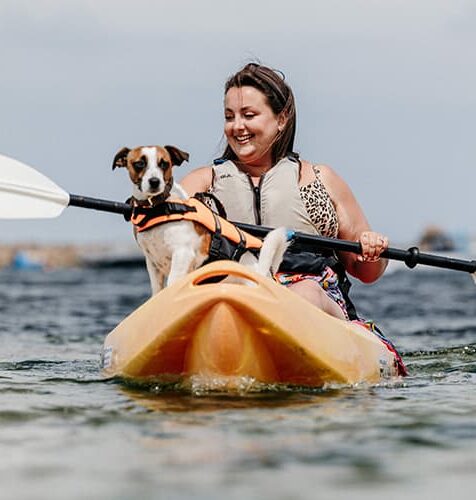 woman and dog kayaking - St Agnes Watersports, Isles of Scilly