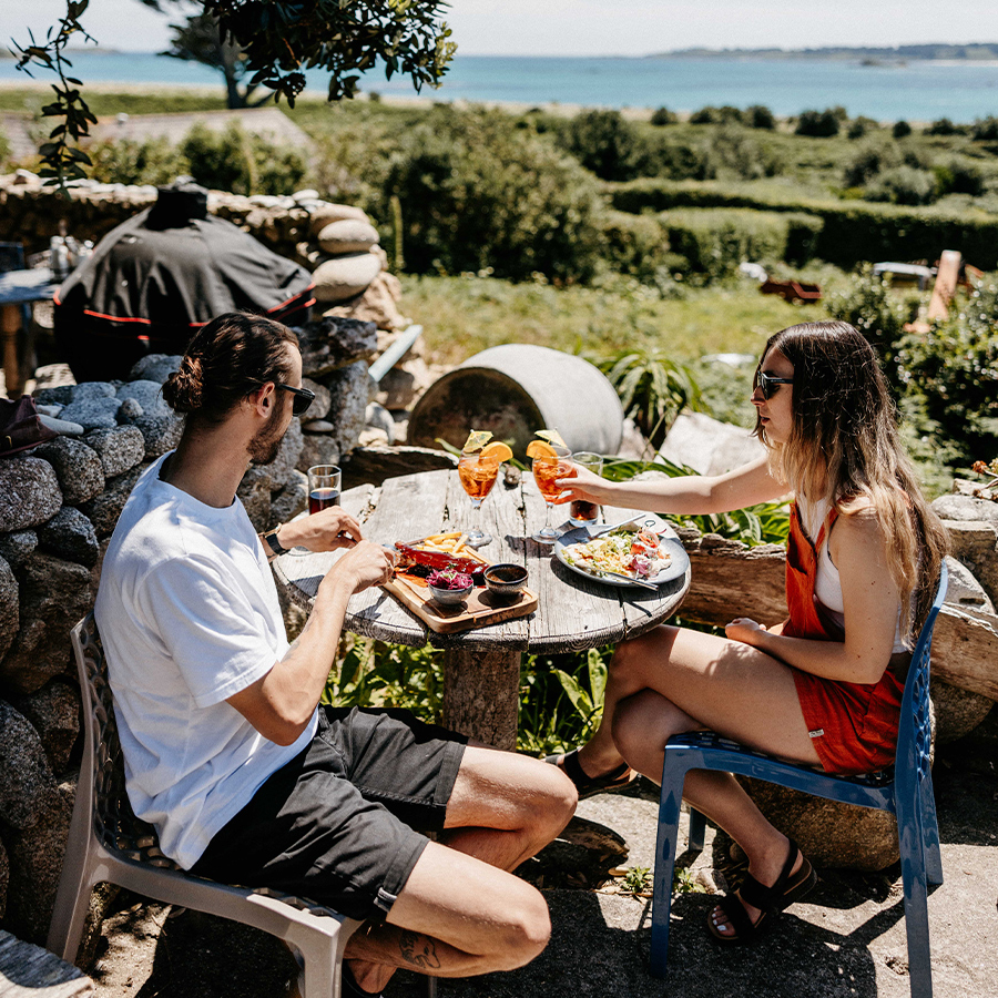 Couple enjoying an alfresco meal at Seven Stones Inn, St Martin's, Isles of Scilly